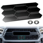 SDPVorn front view garnish installed on Tacoma grille showing clean OEM look