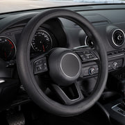 SEG Direct front view of black steering wheel cover showing sleek finish and classic look