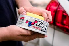 SOFT99 applying Fusso Coat to a light car door for protective coating