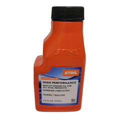 STIHL oil being poured into a fuel jug demonstrating accurate mixing for engine protection