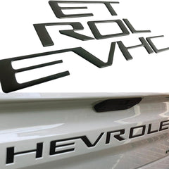 Texflic front view of matte black tailgate letters showing clean factory appearance and improved styling