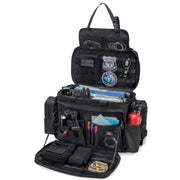 Trunab patrol bag mounted on car front seat showing secure headrest clip benefit