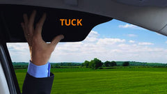 TuckVisor tucked into a car side window for glare protection