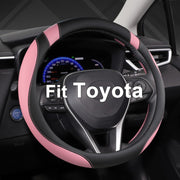 West Llama front view of black and pink steering wheel cover showing style and protection