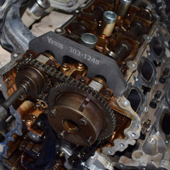 Yuesstloo kit in use on Ford V6 engine demonstrating secure camshaft locking during timing service
