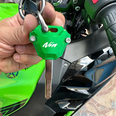 ZYAKOMO key with polyester strap held in hand showing compact scale and ease