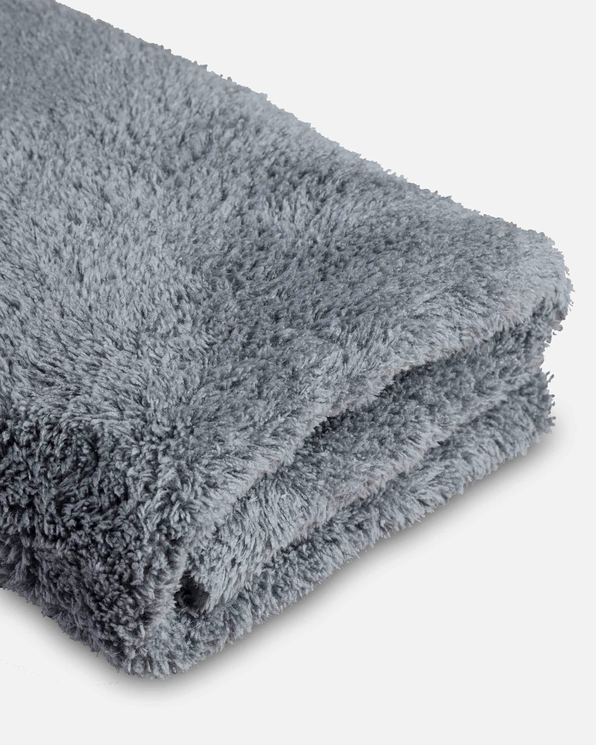 Adam's Polishes towel wiping dashboard leaving dust-free interior surfaces