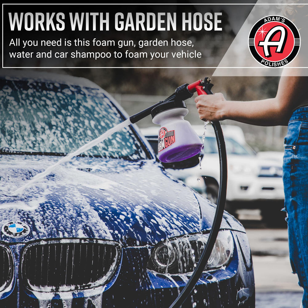 Adam's Polishes spraying thick foam across a car hood, improving dirt lift and cling
