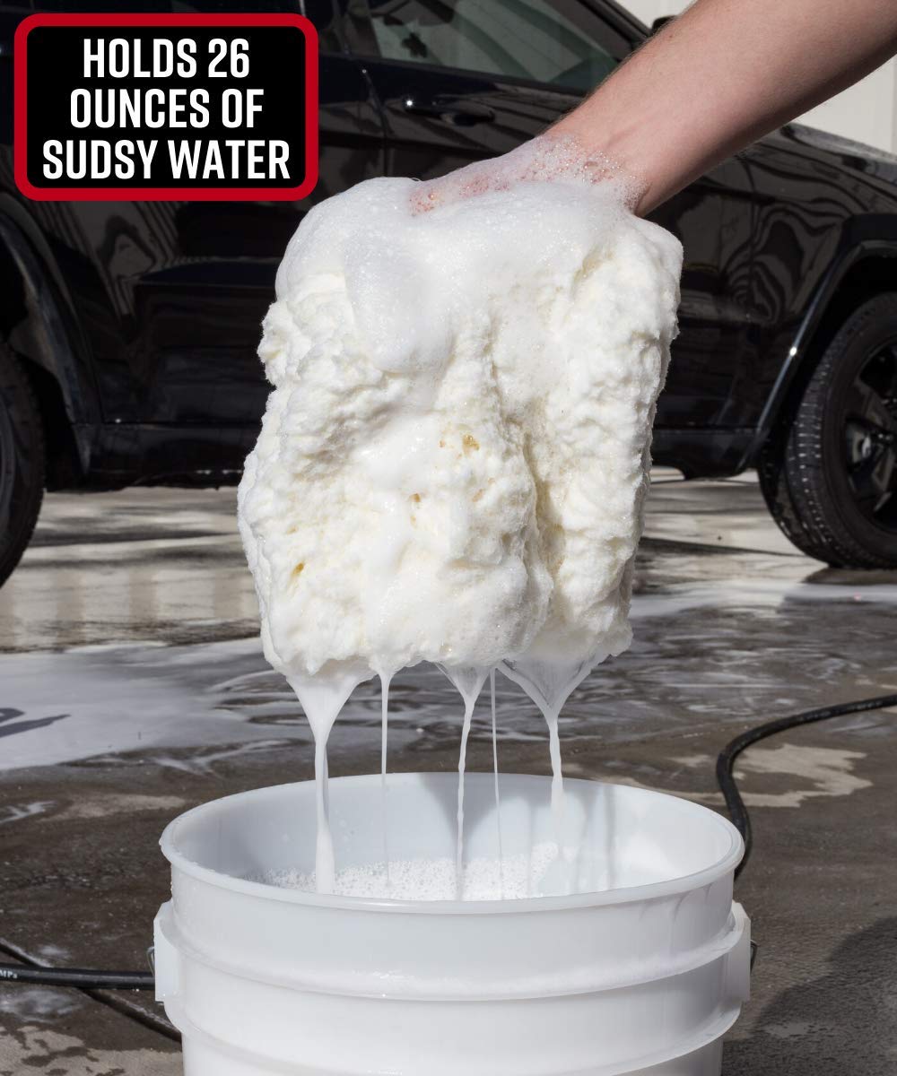 Adam's Polishes rinsing pad under tap to remove grit and maintain paint-safe performance