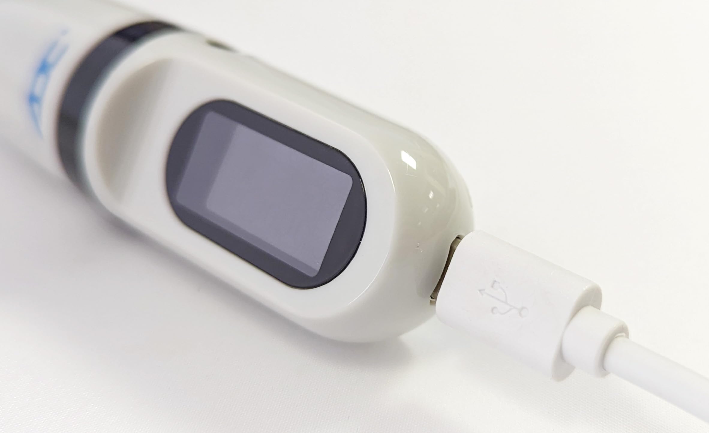 ADC Adtemp‑Mini 432 with micro USB cable included to show rechargeable benefit