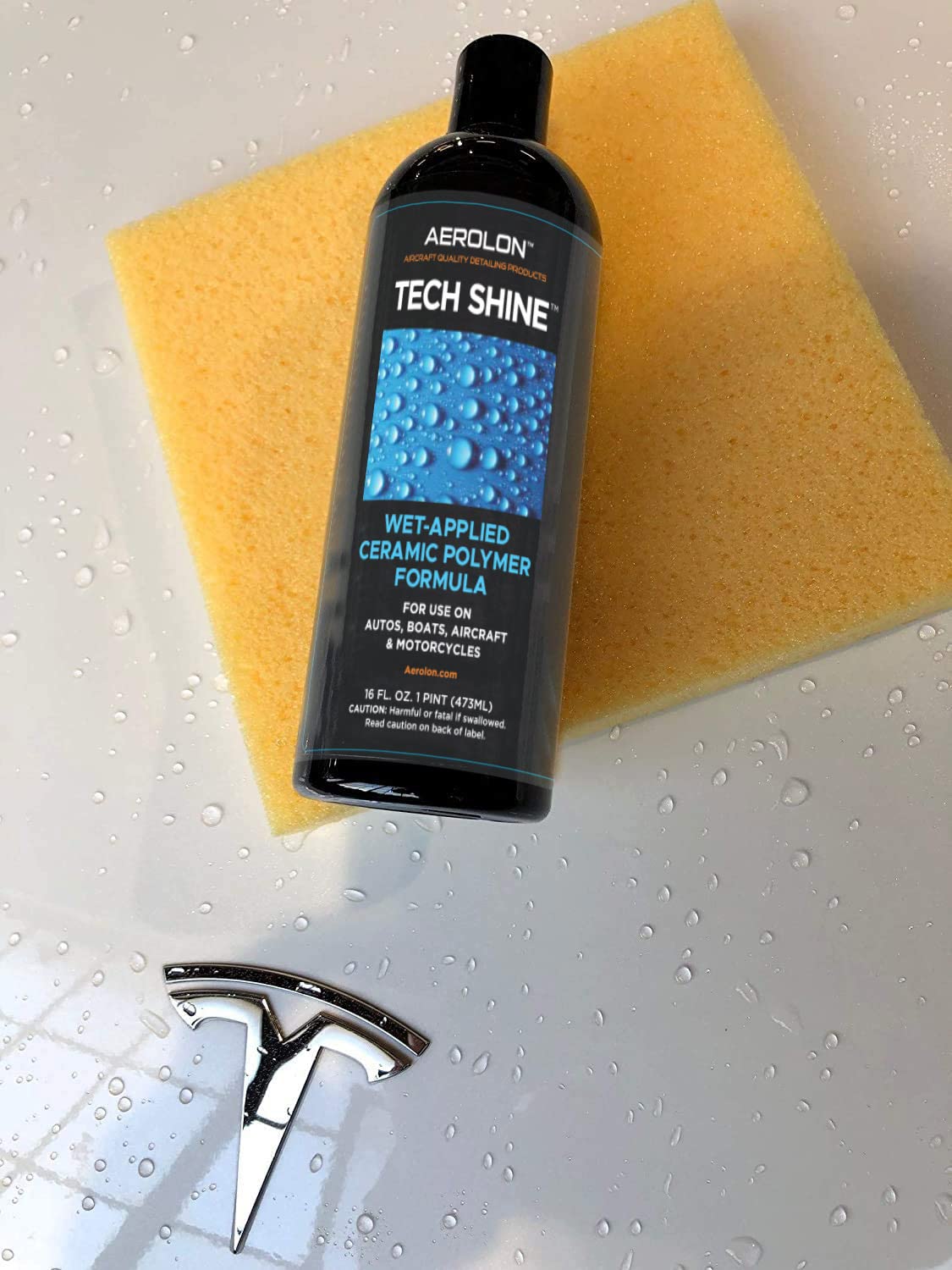 Aerolon Tech Shine bottle beside a hand to show compact size and multiple uses
