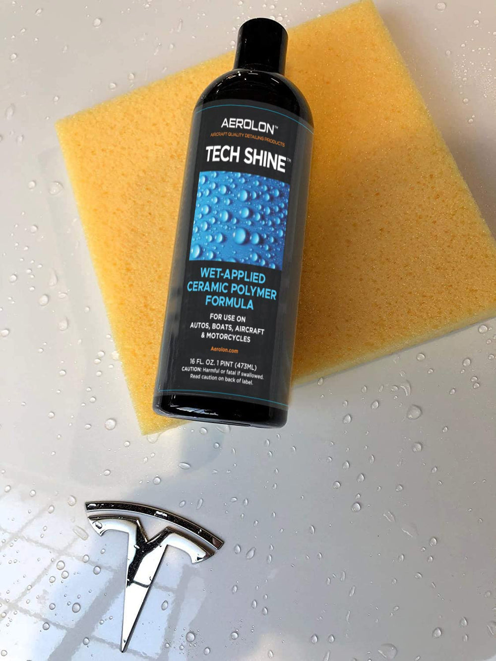 Aerolon Tech Shine bottle beside a hand to show compact size and multiple uses