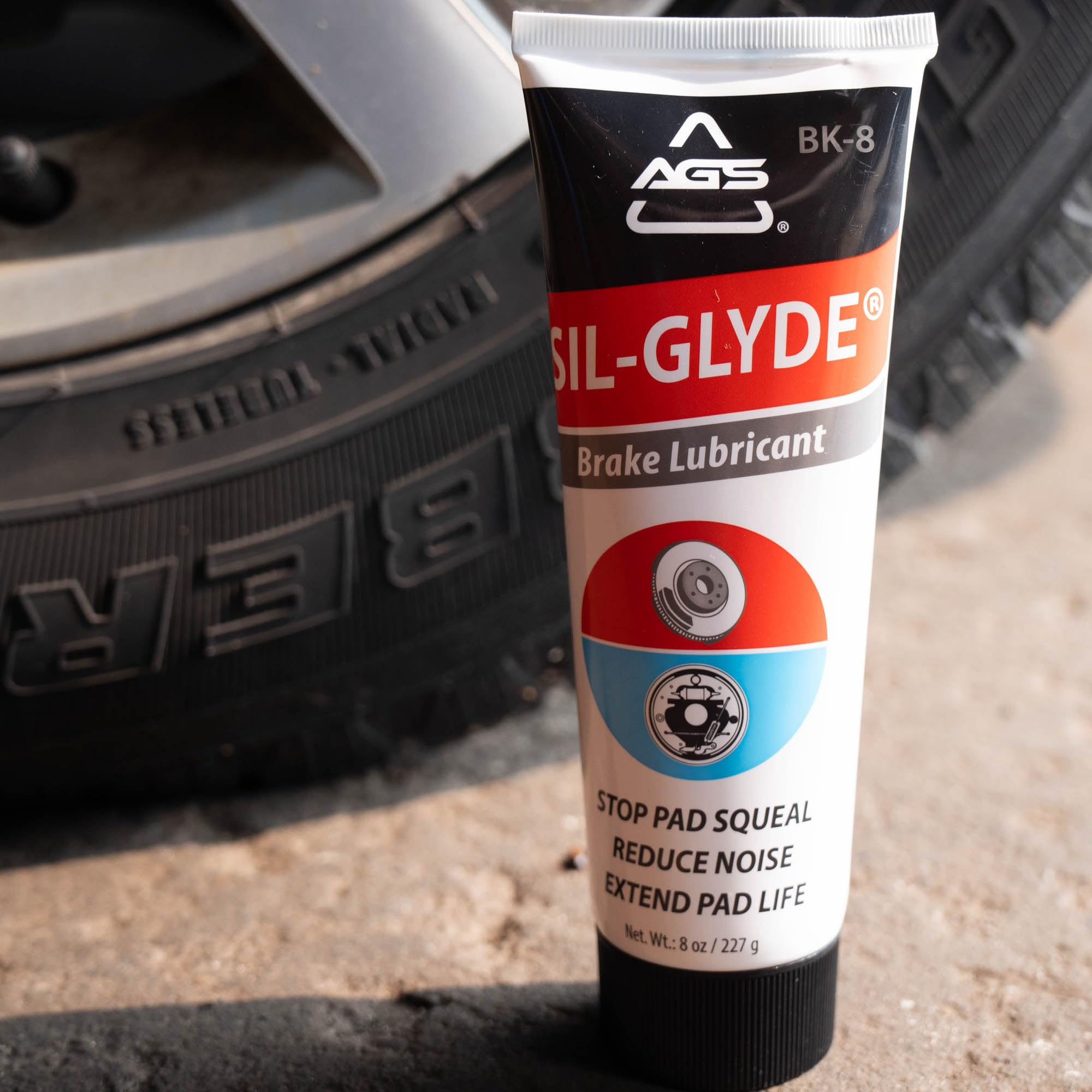 AGS SIL-Glyde applied to caliper pin demonstrating easier slide and reduced noise
