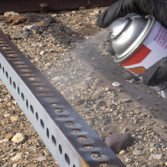 AGS RUST SOLUTIONS spraying on metal railing illustrating fast application and weather protection