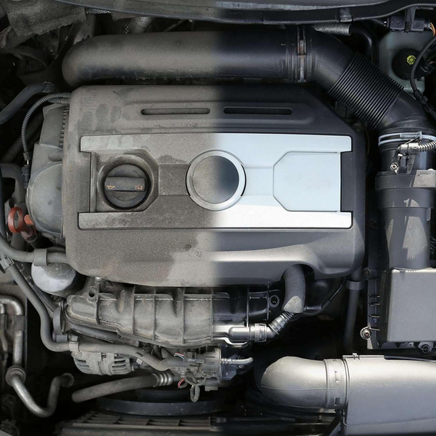 Akfix A115 spraying onto greasy engine parts to quickly loosen grime and oil