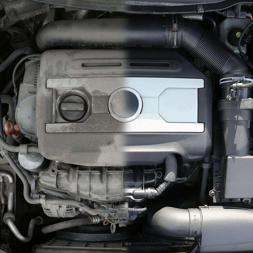 Akfix A115 spraying onto greasy engine parts to quickly loosen grime and oil