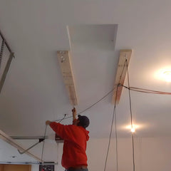 ALLCOS lifted hardtop stored overhead illustrating freed garage floor and damage prevention benefit