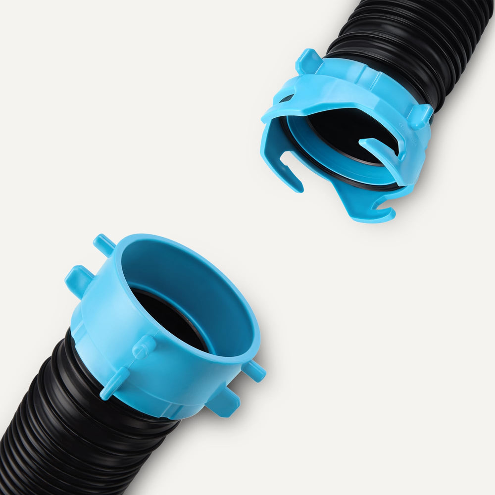 Amazon Basics hose connected at a campground dump station demonstrating easy setup