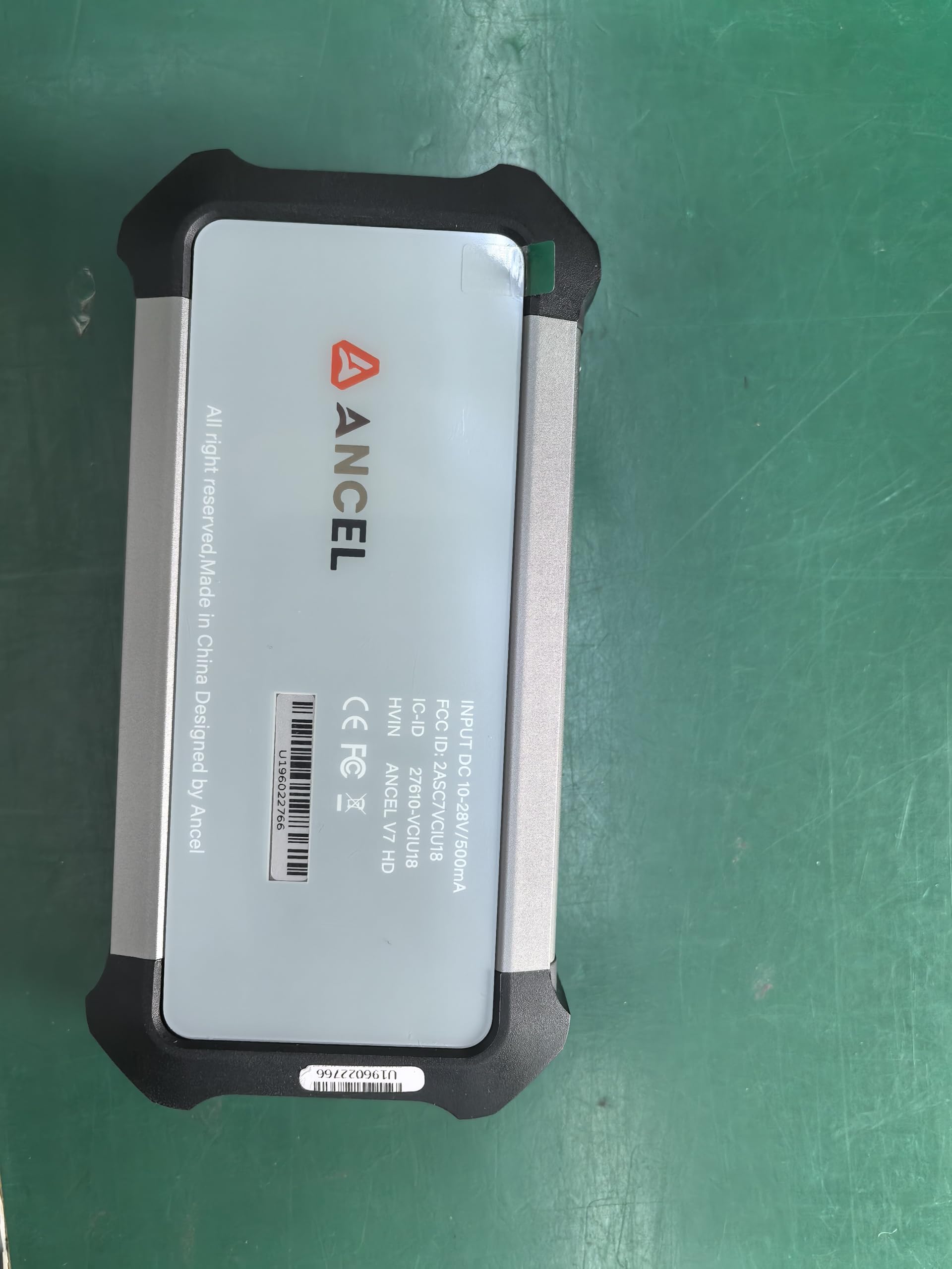 ANCEL X7HD PRO in a garage setting diagnosing a heavy-duty truck