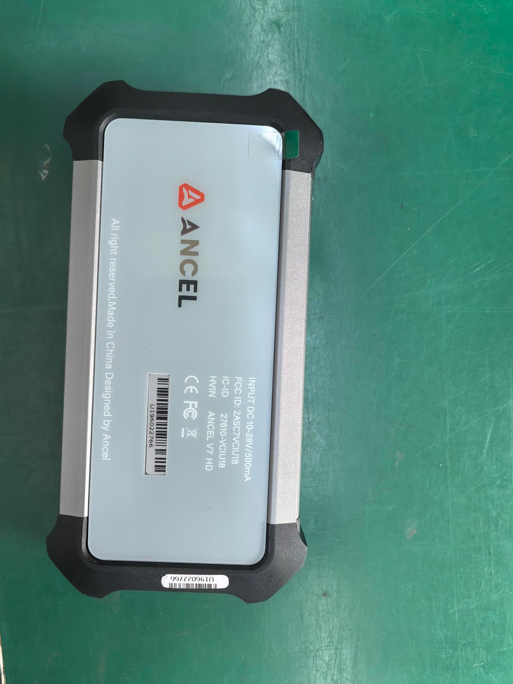 ANCEL X7HD PRO in a garage setting diagnosing a heavy-duty truck