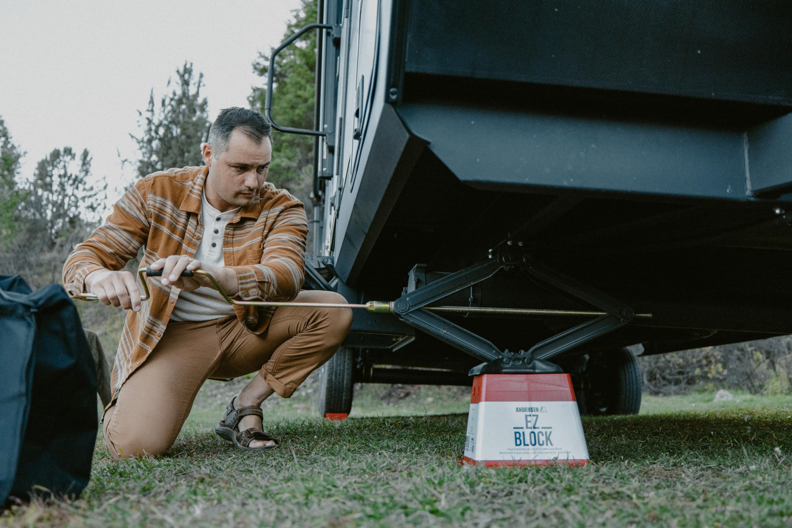 Andersen Hitches EZ Block placed under RV jack offering stable support on soft terrain