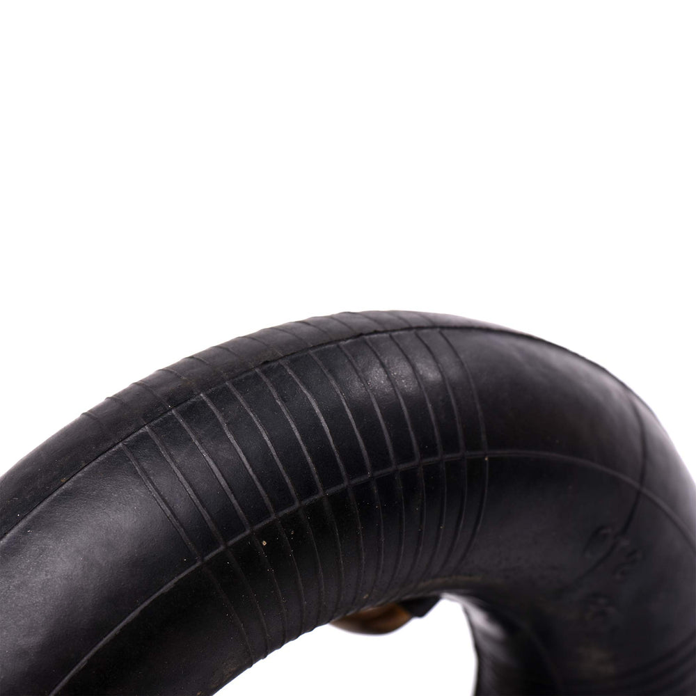AR-PRO inner tube beside a ruler for clear size comparison and fit assurance