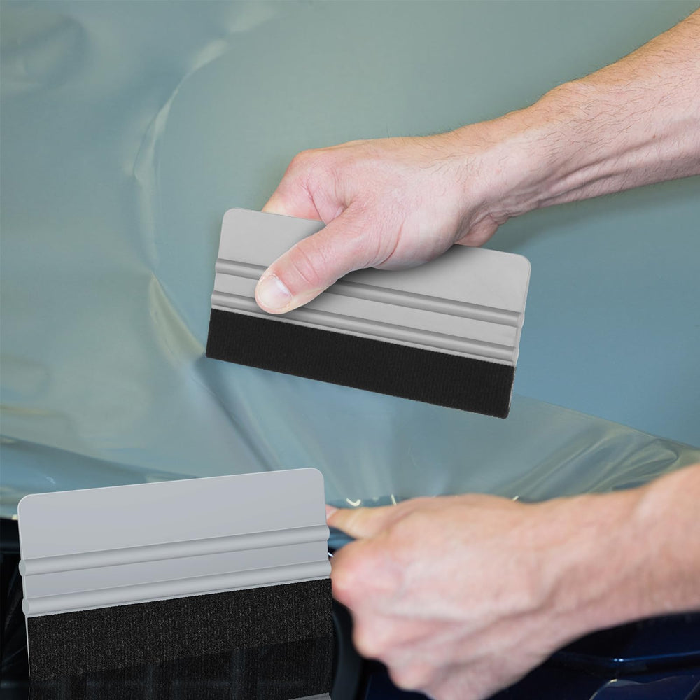 Arayker squeegee on workbench with tools depicting readiness for multiple projects