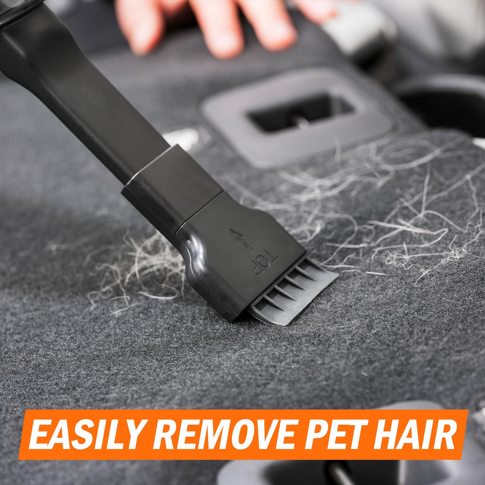 Armor All vacuum in use on car seat demonstrating quick removal of crumbs and pet hair