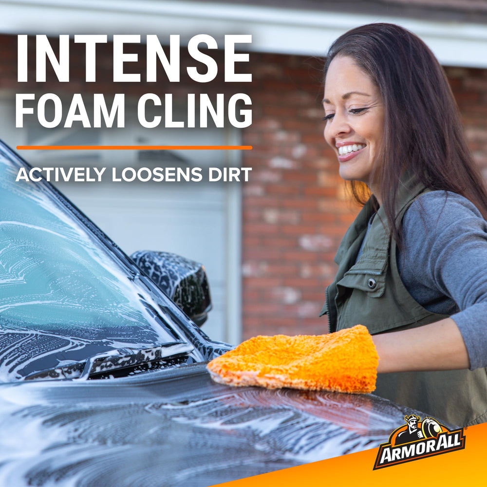 Armor All foam applied to car hood illustrating long-lasting suds effectiveness