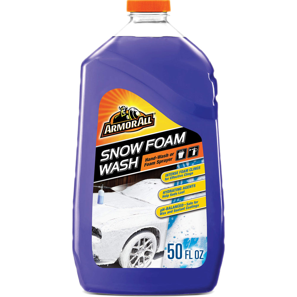 Person using Armor All snow foam in driveway for easy, safe exterior wash