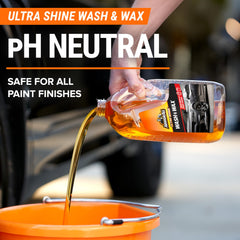 Armor All Ultra Shine soap pouring into bucket creating rich foam
