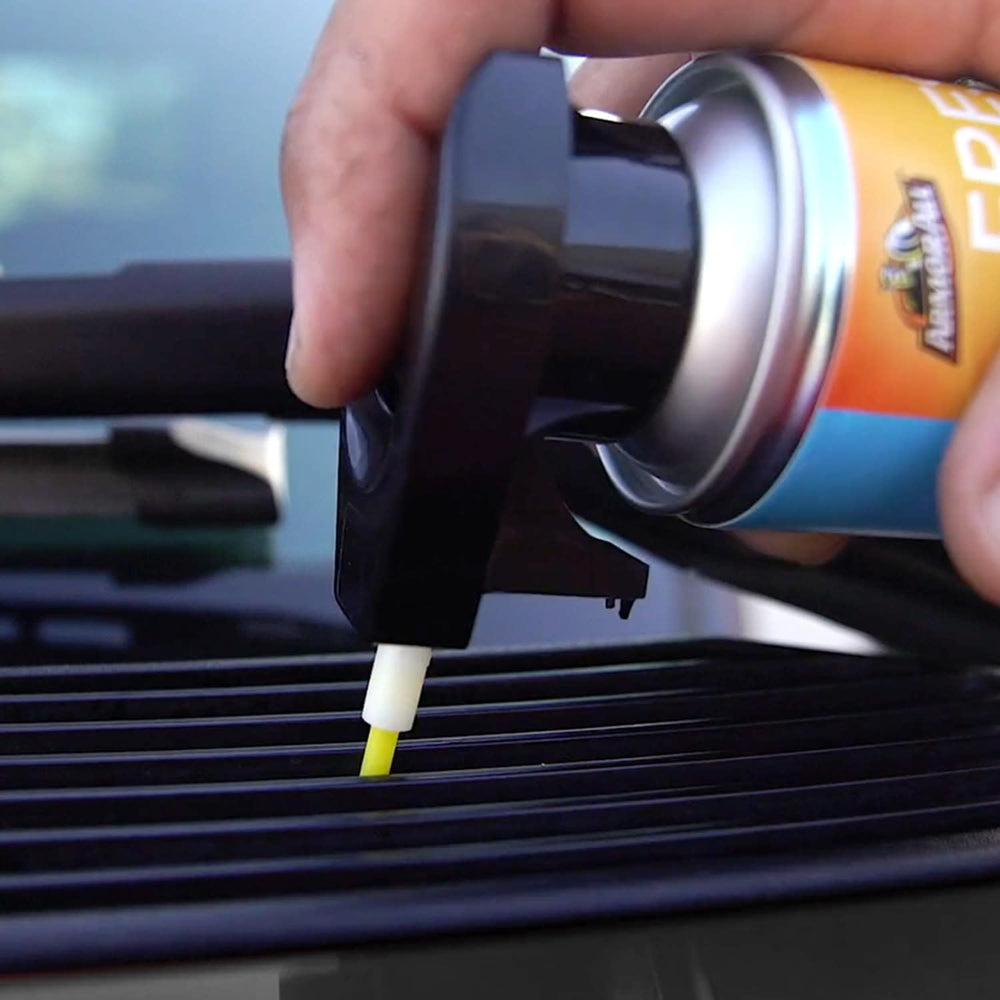 Armor All being sprayed into car vent to neutralize odors quickly