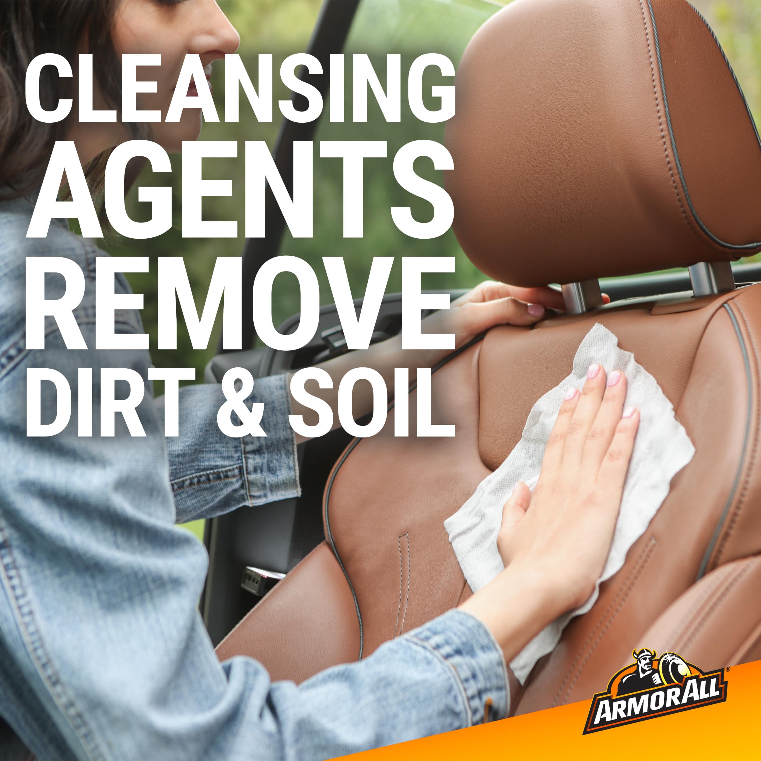 Armor All wipe cleaning steering wheel to restore grip and look