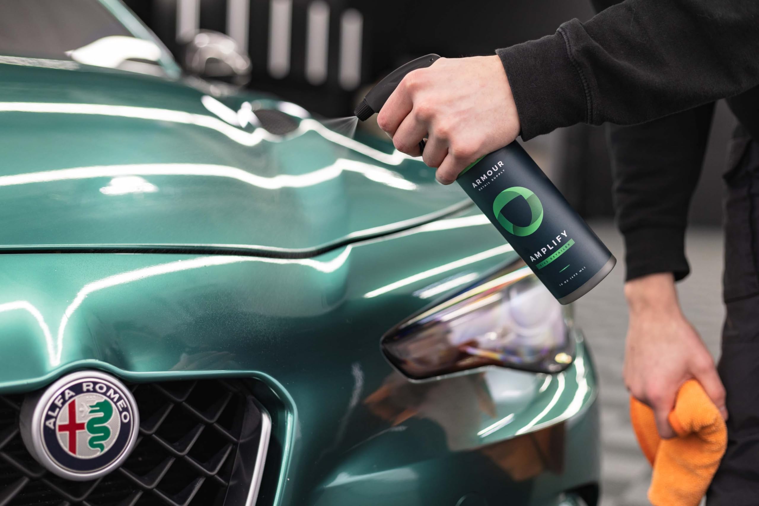 Armour Detail Supply bottle beside a polished car illustrating fast gloss enhancement benefit