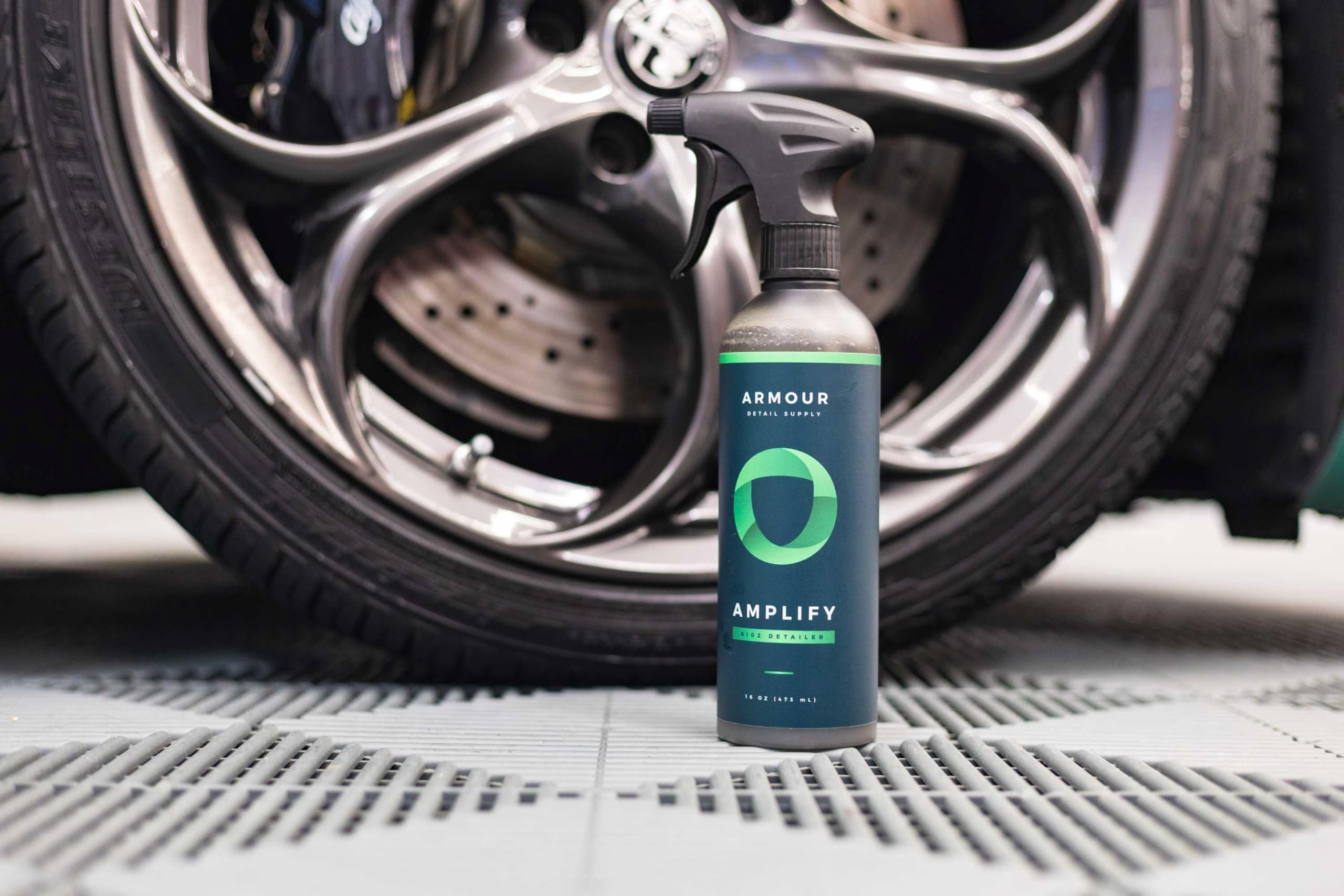 Hand wiping car with microfiber and Armour Detail Supply for effortless application benefit