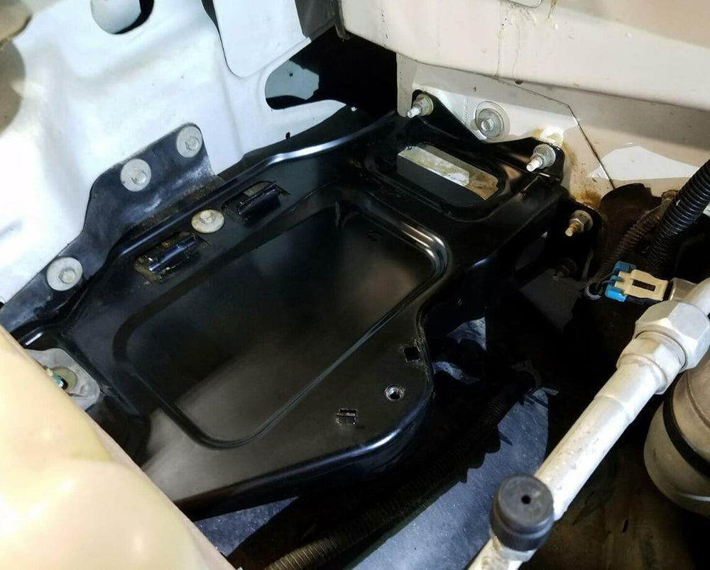 ARONOVA tray installed in vehicle demonstrating correct fit and battery support