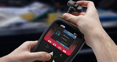 ATEQ VT37 activating a TPMS sensor on a tire to confirm successful communication