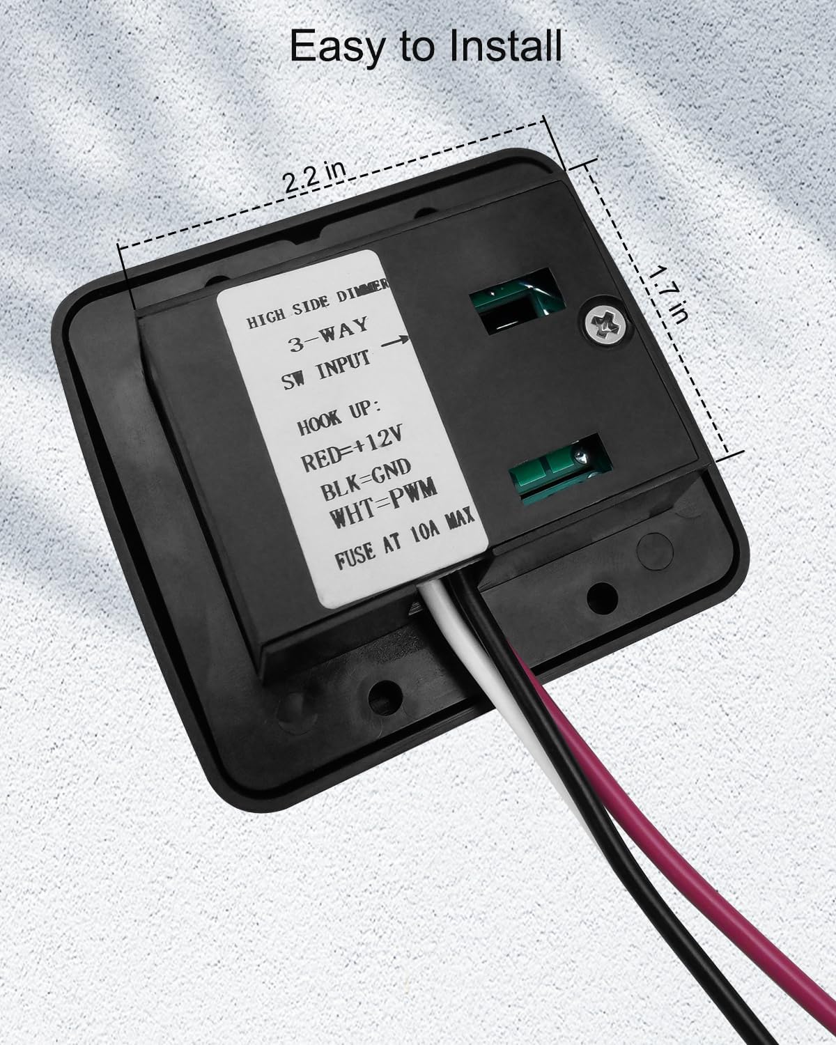 AUGREX dimmer next to coin for scale showing compact size