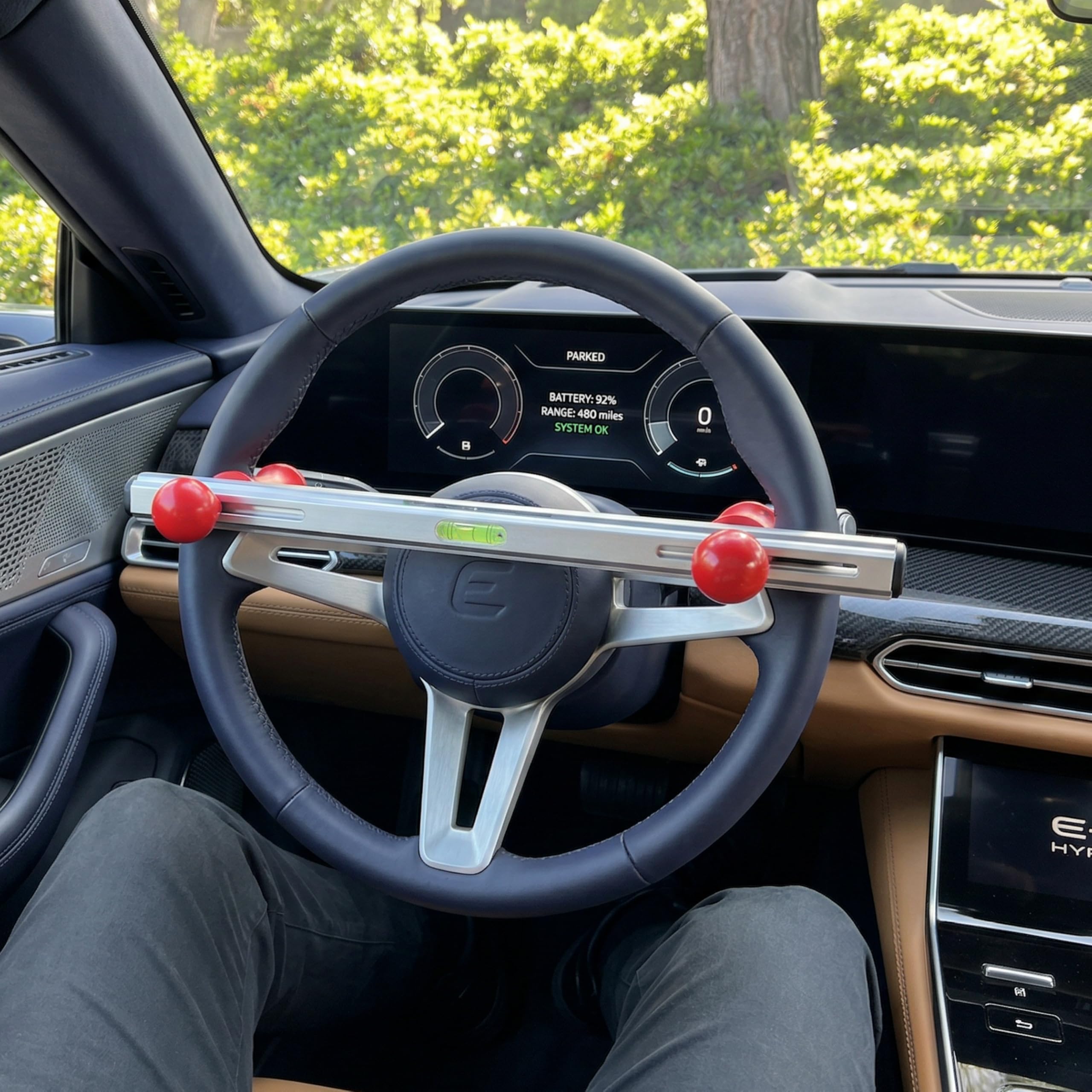 AutoSolo shown next to ruler for size comparison, fits most 8–15 inch wheels