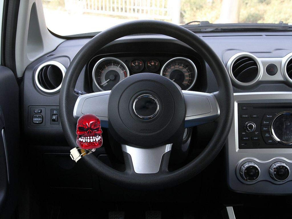 Bashineng skull spinner next to hand showing compact size and ergonomic benefit