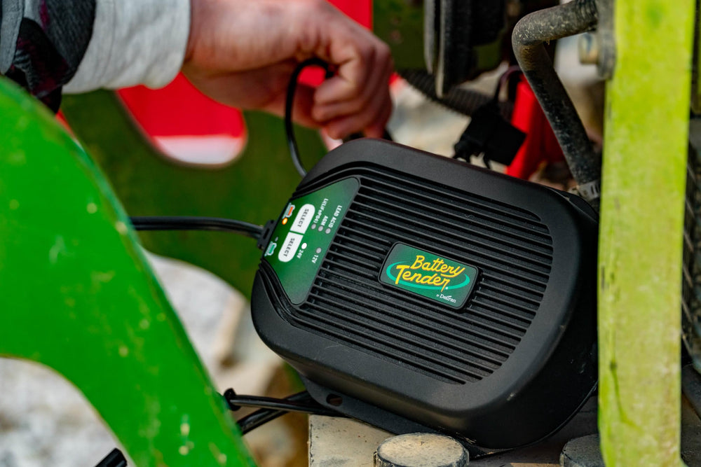 Battery Tender held in hand showing compact size and easy onboard fit