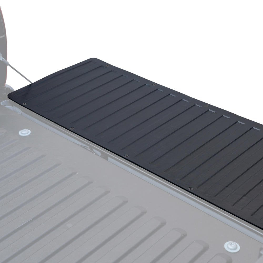 BDK mat in a worksite scene protecting tailgate from tools and heavy gear