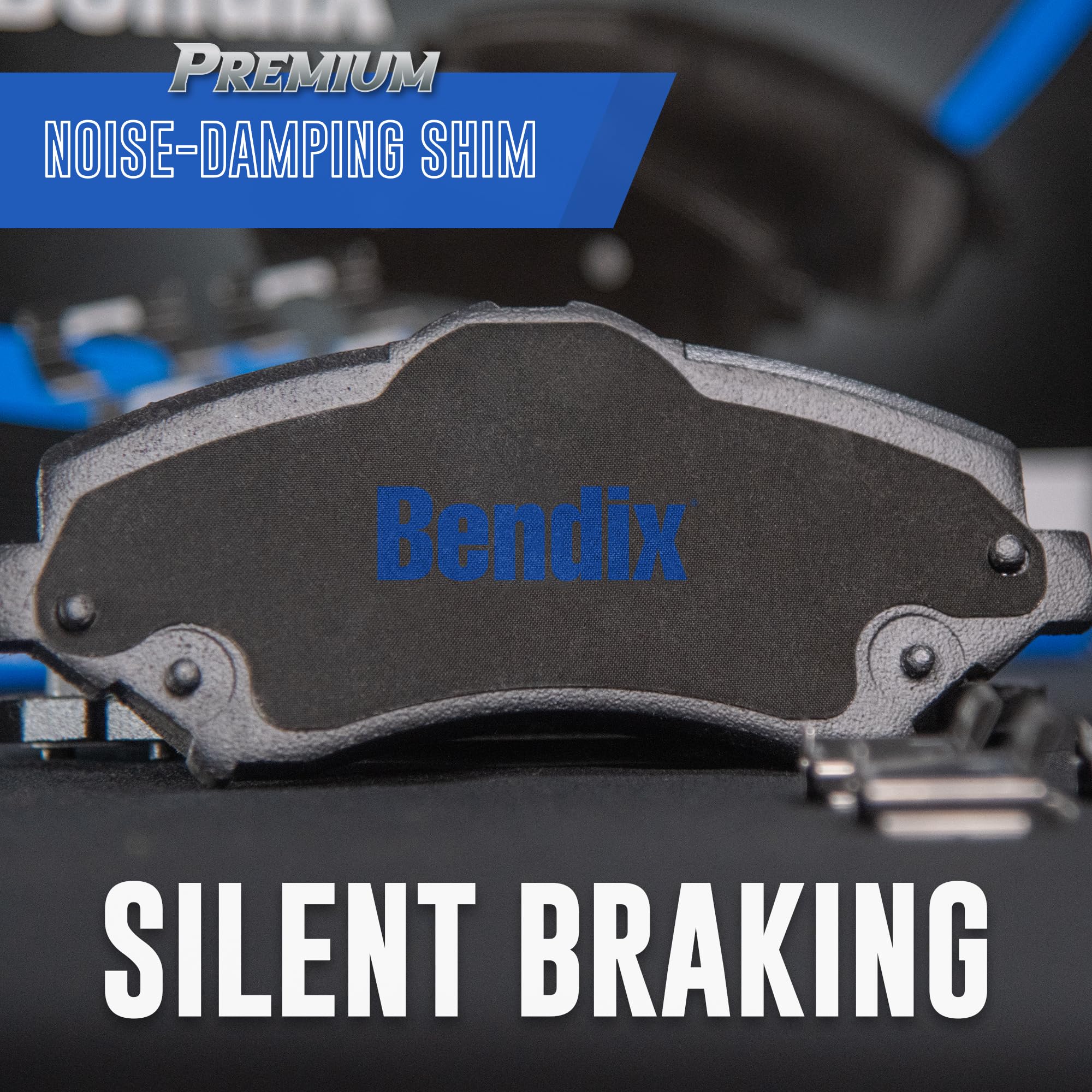 Bendix pad next to coin for scale showing compact front pad size