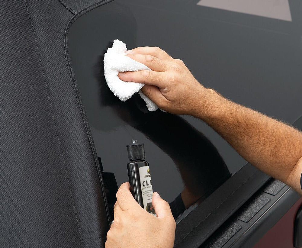 Bestop being used on a Jeep soft-top window showing improved clarity