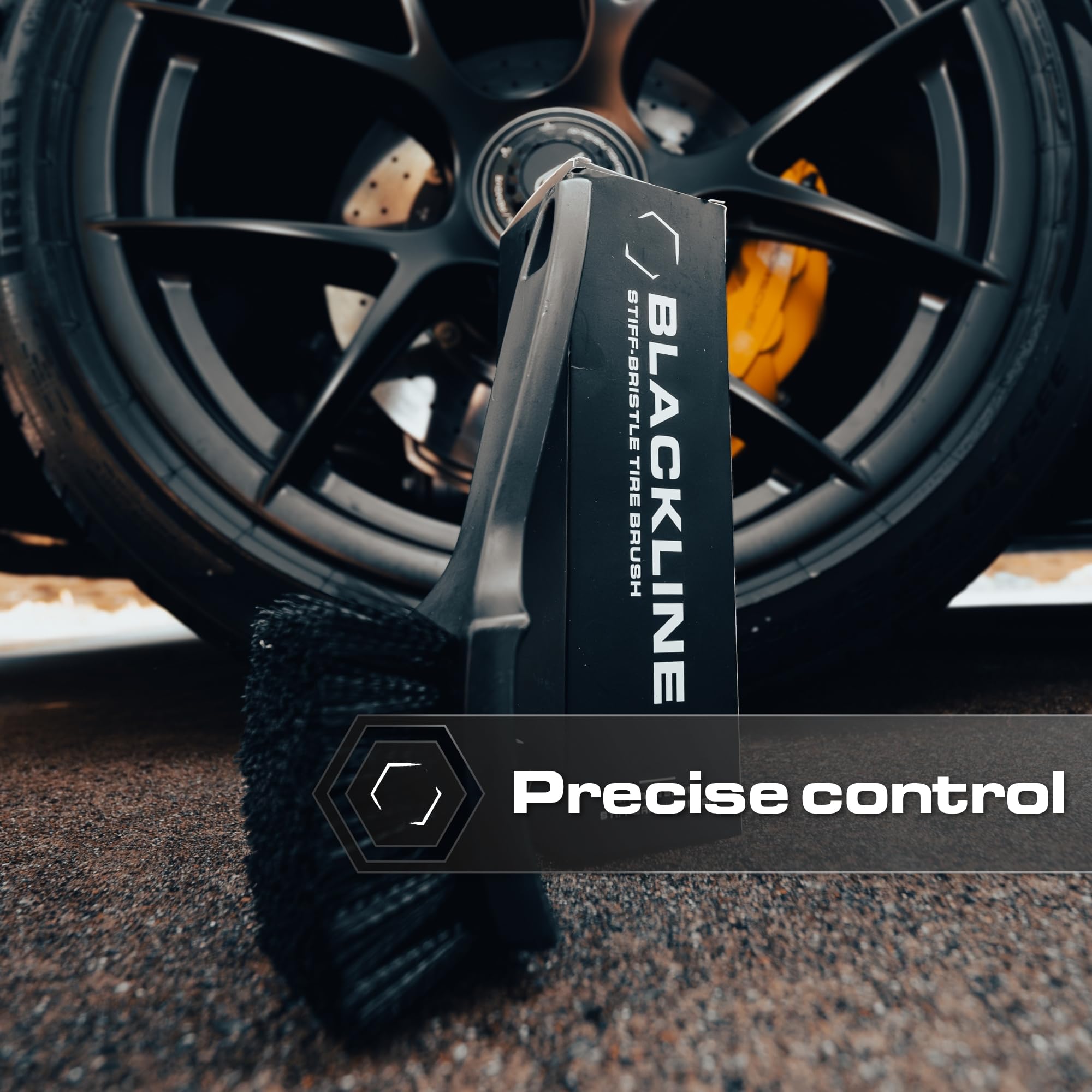 Blackline brush next to hand showing scale for easy handling benefit