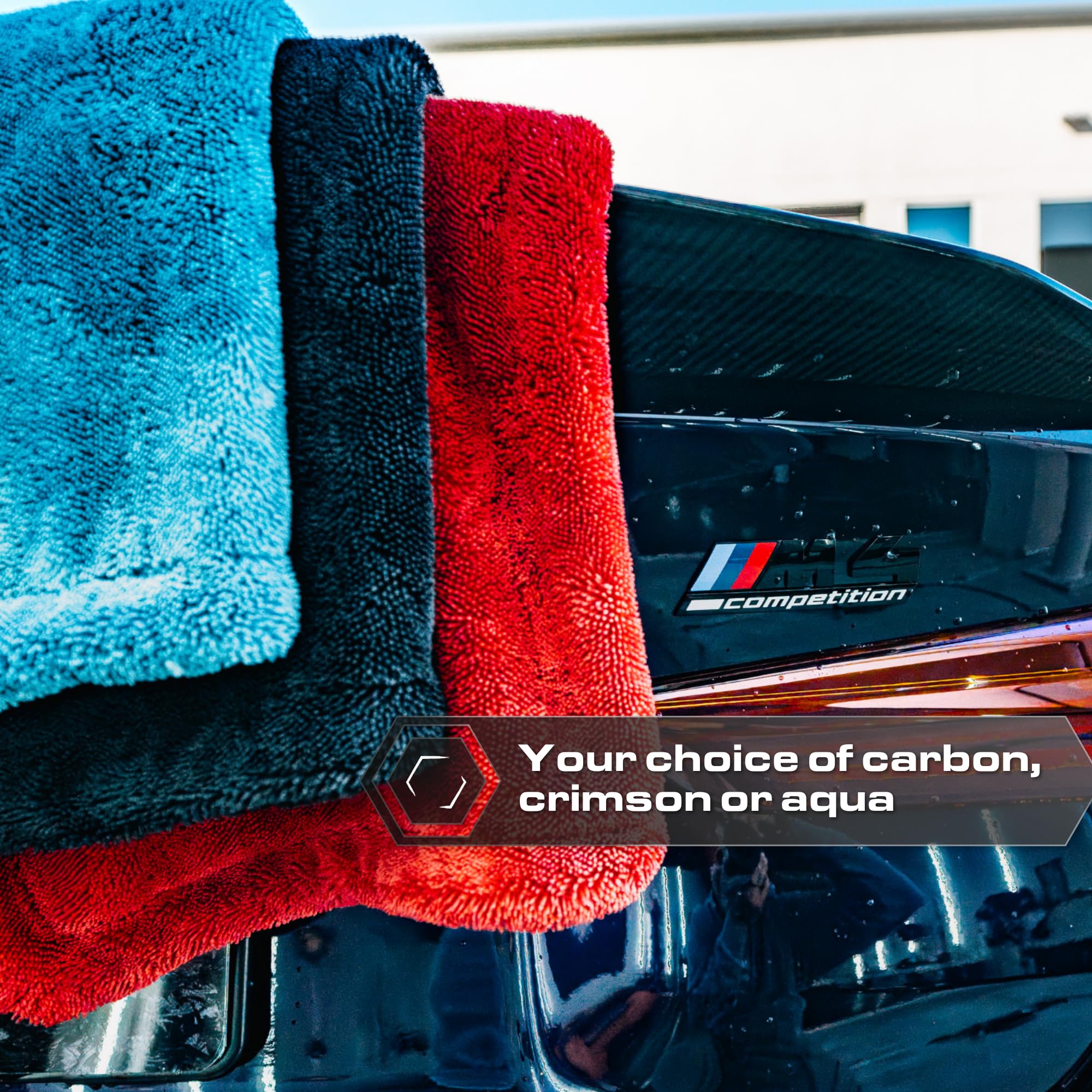 Blackline towel draped on car in driveway showing quick post-wash results