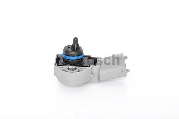Bosch sensor next to ruler showing compact size for easy aftermarket replacement