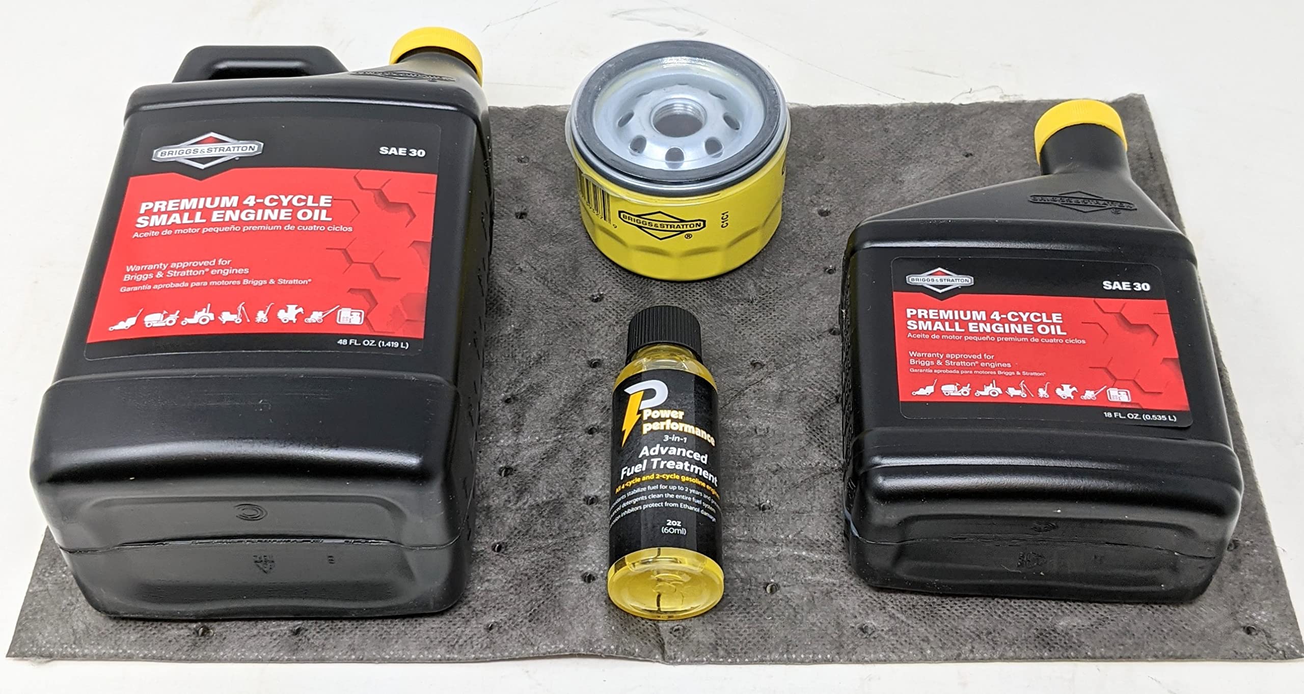 Briggs & Stratton SAE 30 oil bottles close-up for correct viscosity