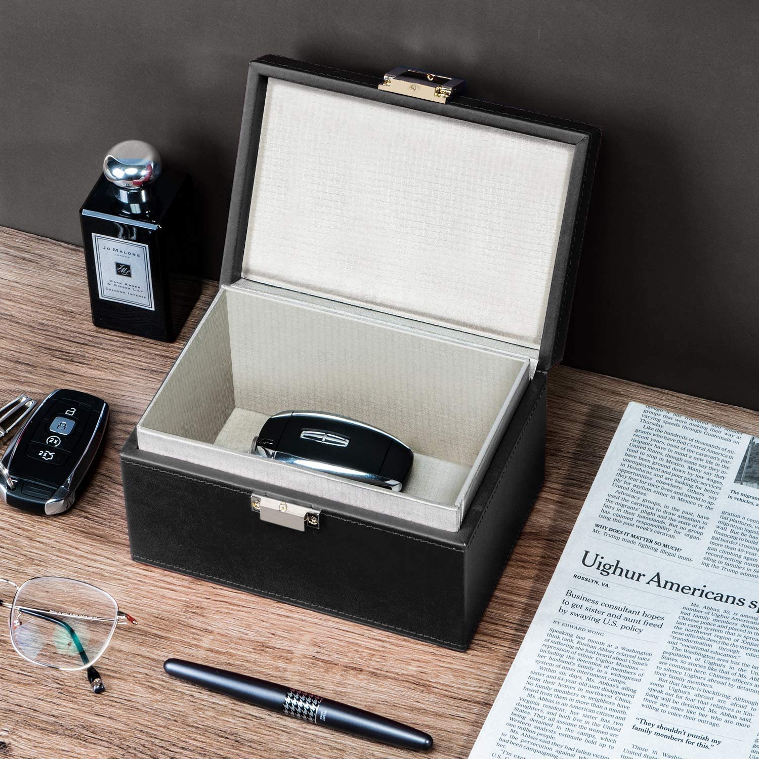 briidea Faraday box beside smartphone to show size and ease of home placement
