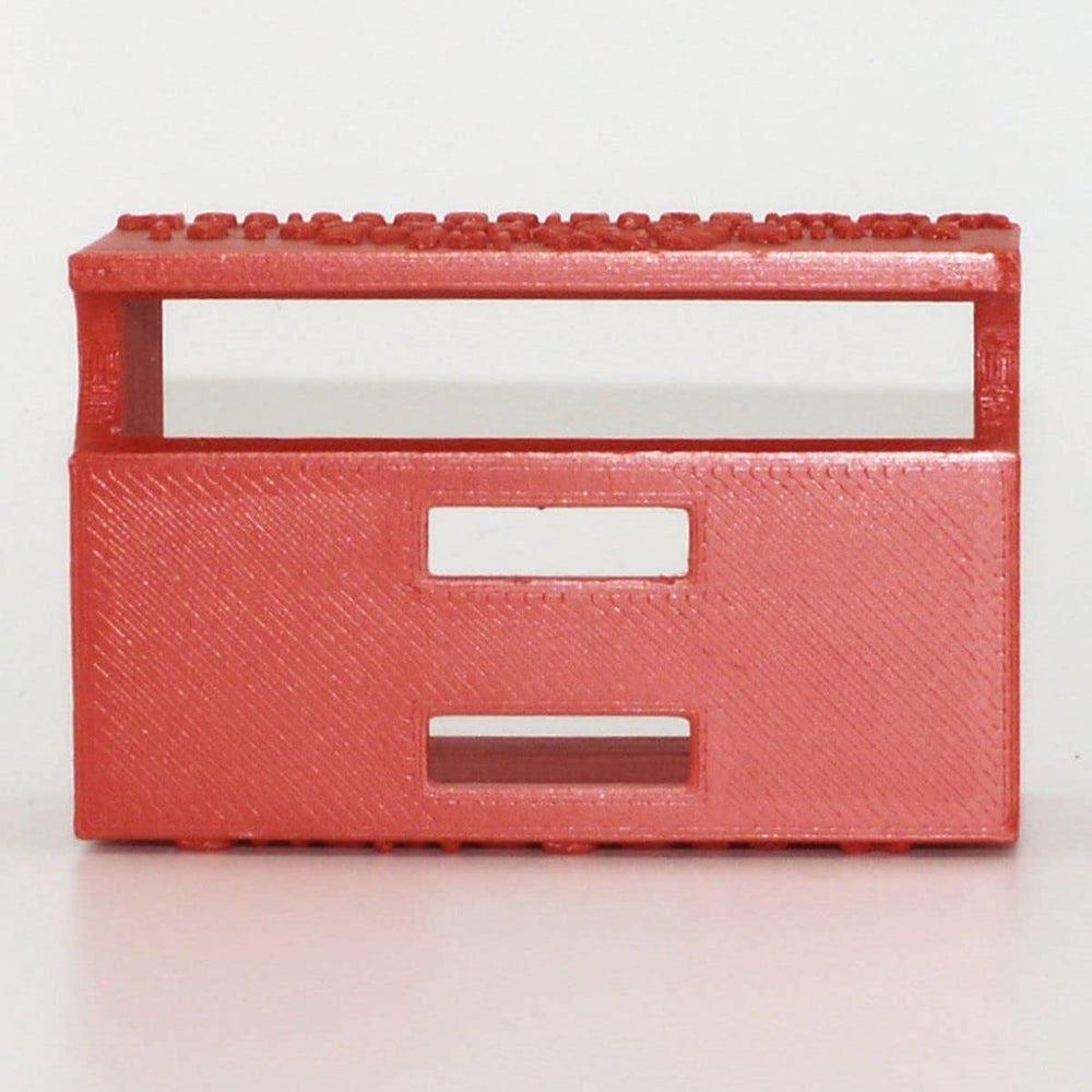 Buckle Boss close-up of guard covering release button for tamper protection
